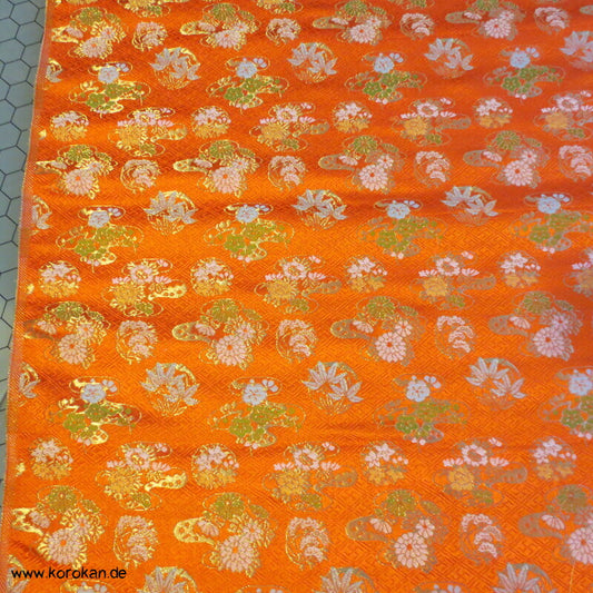 Musterkreise auf orange breiter Seidenbrokat
