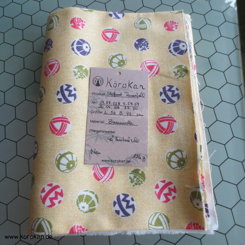 Stoffrest schwere Baumwolle Temaribälle auf hellgelb