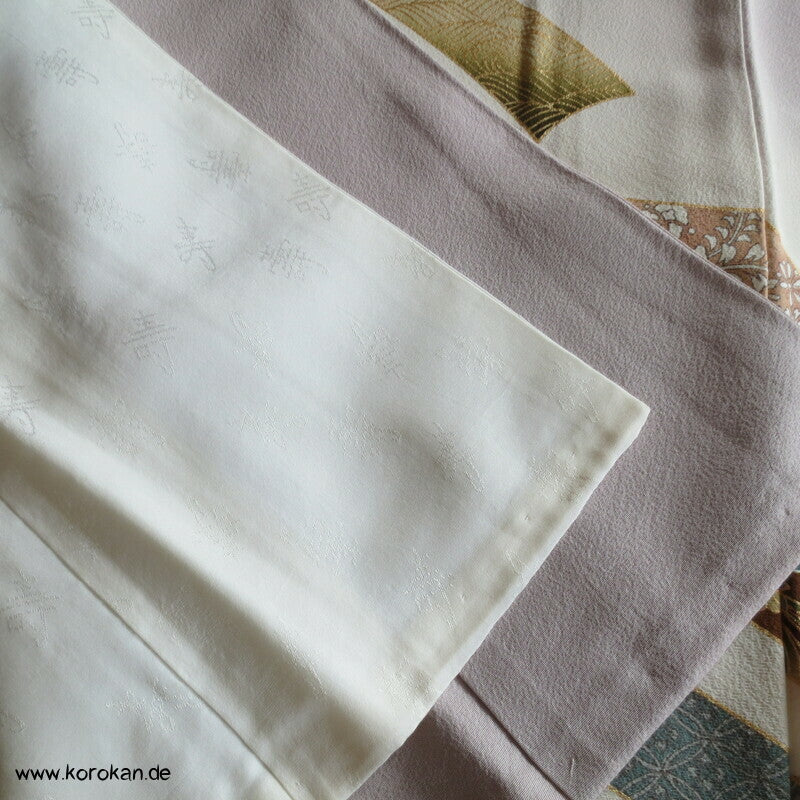 Noshibündel auf blasslila Seidencrepe Iro Tomesode Kimono