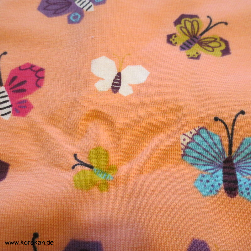 Baumwolljersey Schmetterlinge auf apricot