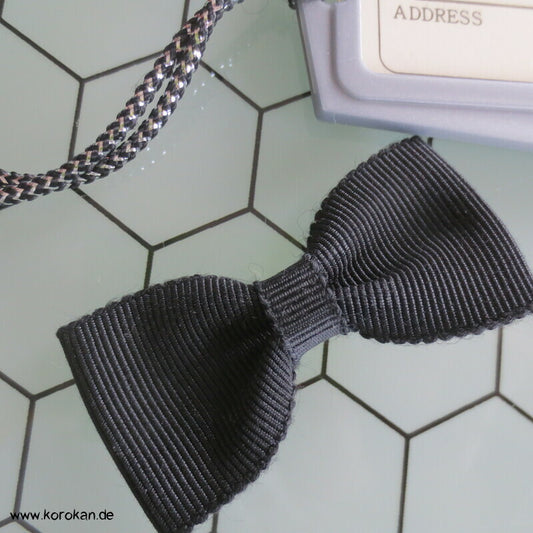 Trauerschleife und Kofferanhänger