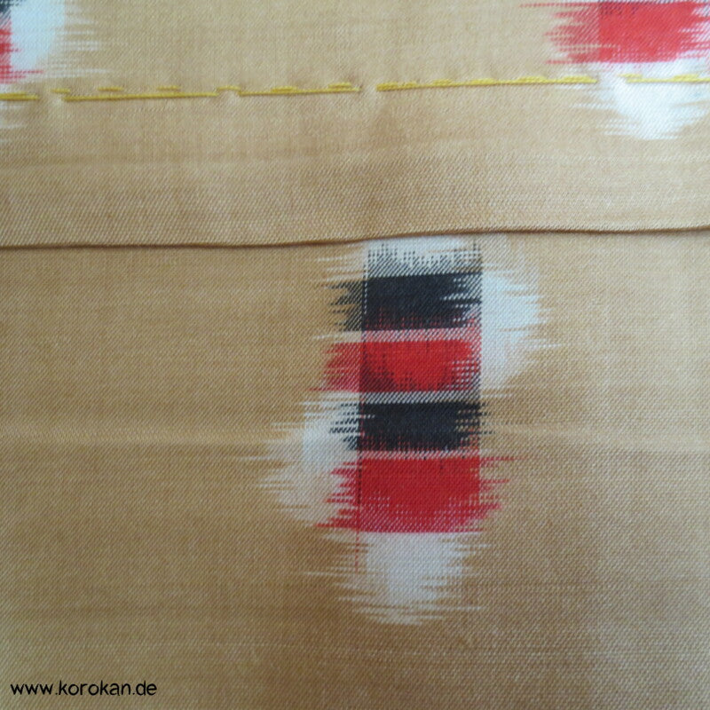 goldbeige mit rot-schwarz-weißen Elementen Hitoe Meisen Kimono
