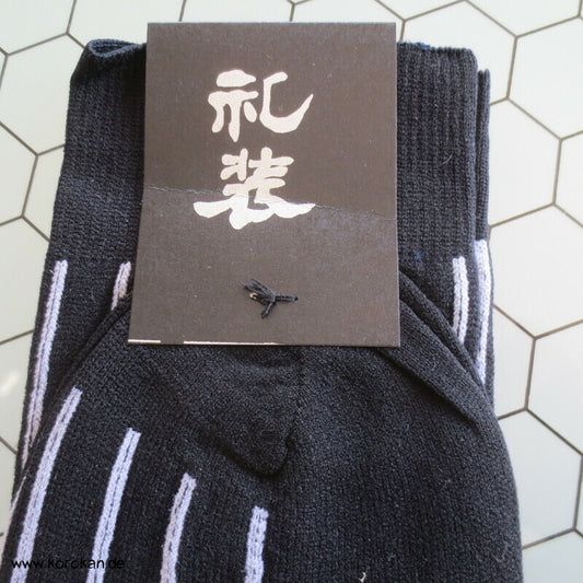 Socken schwarz mit weißen Streifen