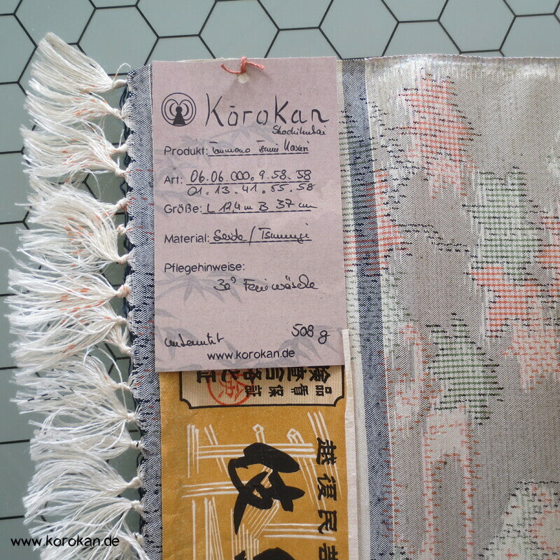 Japanmuster Kasuri schilfgrüne Tsumugi Seide