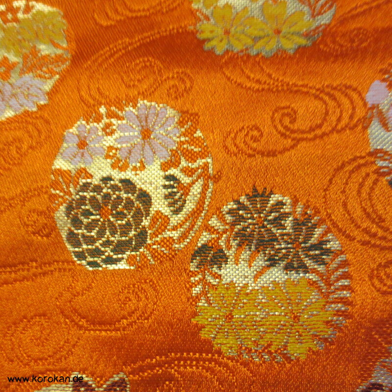 Blumenkringel auf orange breiter Seidenbrokat