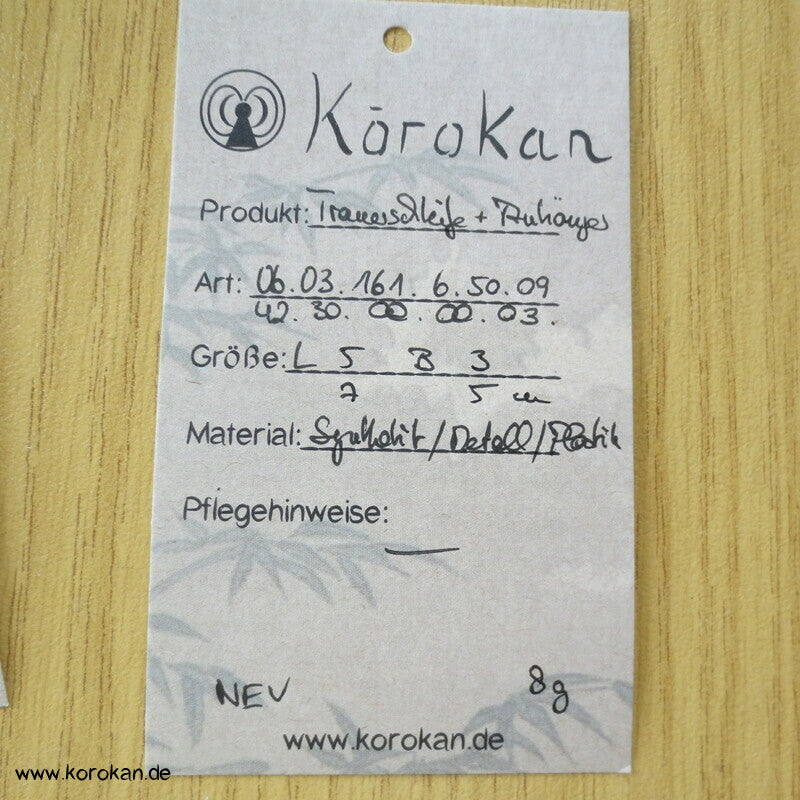 Trauerschleife und Kofferanhänger