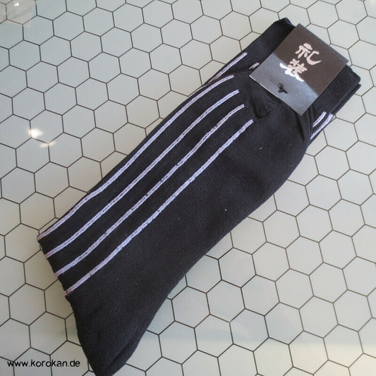 Socken schwarz mit weißen Streifen